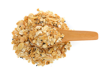 nuts and seeds muesli in wood spoon isolated on white background