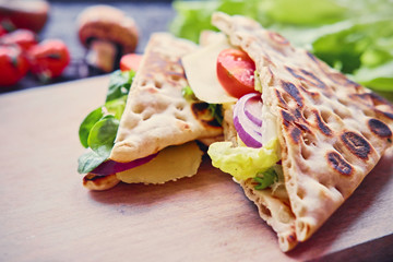 Pita bread with ham, cucumber and tomatoes.