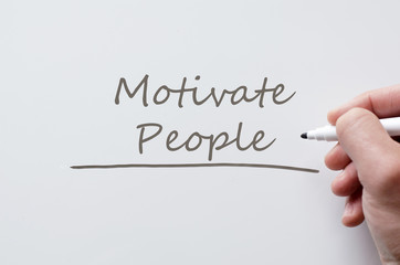 Motivate people written on whiteboard