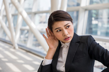 young businesswoman prick up her ears