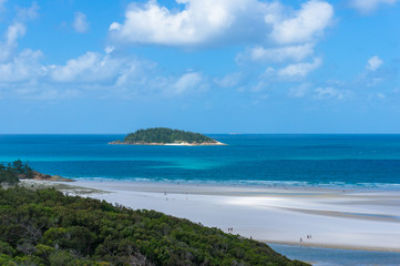 Coral reef island and tropical beach at sunny day