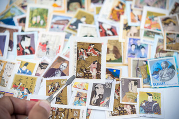 Fototapeta na wymiar A postage stamp printed in Japan showing a painting of a Japanese people.