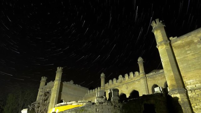 Star Trails Over Scenic Abandoned Ruin of Building. Time Lapse. 4K.
