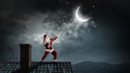Fototapeta na wymiar Santa catch the moon