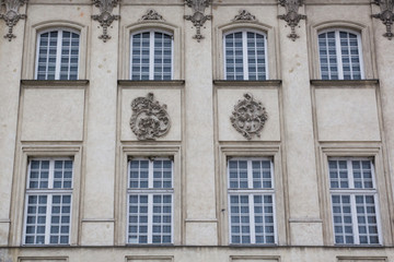 Eight vintage design windows on the facade of the old house.