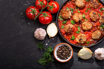 pan of meatballs with tomato sauce