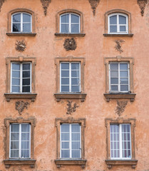 Fototapeta na wymiar Vintage design windows on the facade of the old house.