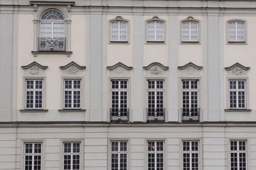 Fototapeta na wymiar Vintage design windows on the facade of the old house.