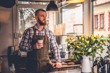 Redheads craft coffee seller in a small street cafe.
