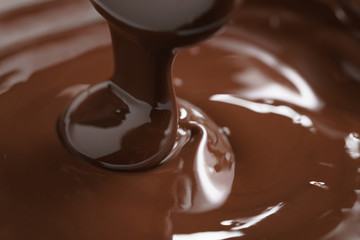 macro photo of premium dark chocolate pour in bowl