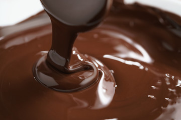 macro photo of premium dark chocolate pour in bowl