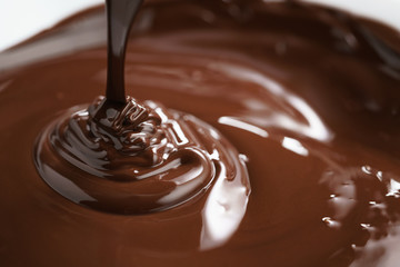 macro photo of premium dark chocolate pour in bowl