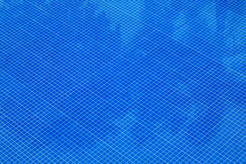 Plakat Blue swimming pool rippled water .
