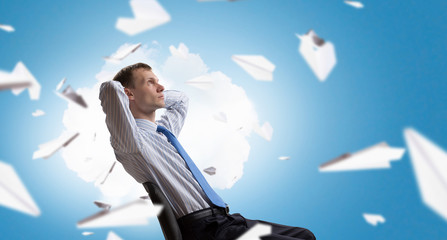 Businessman in chair having rest