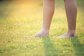 barefoot on the green grass