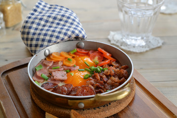 Sunny side up egg in a pan on dinning table