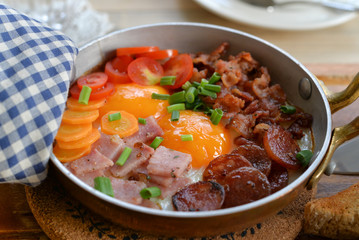 Sunny side up egg in a pan on dinning table