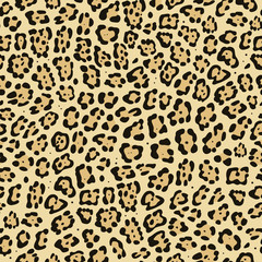 Seamless pattern. Imitation print of skin of jaguar. Black and brown spots on beige background.