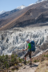 Fototapeta premium Trekker in front of Manaslu glacier on Manaslu circuit trek in Nepal