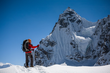 Trekker is walking by Renjo La pass in Everest region