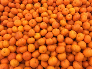 Closeup of oranges on a market

