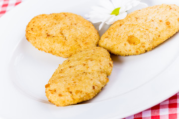 Chicken cutlets on white plate