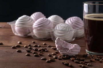 White and pink zephyr with a cup of coffee