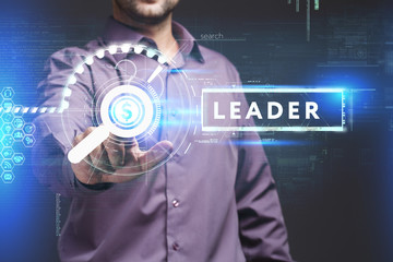 Business, Technology, Internet and network concept. Young businessman working on a virtual screen of the future and sees the inscription: Leader