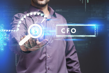 Business, Technology, Internet and network concept. Young businessman working on a virtual screen of the future and sees the inscription: CFO