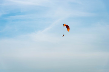 man ride Paramotor flying in the sky