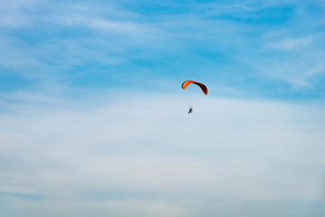 man ride Paramotor flying in the sky