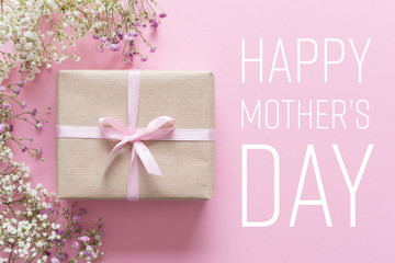 Mother's day card, pink background with white flowers and a present
