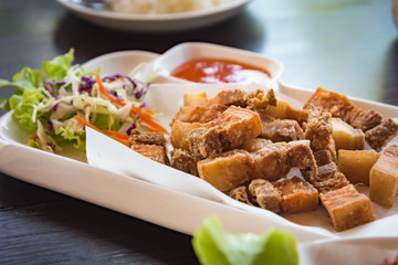 Fried pork with salt in a white plate