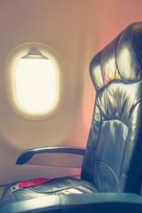 Airplane seats in the cabin . ( Filtered image processed vintage effect. )