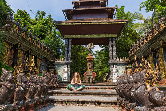 Young woman and temple of Thailand
