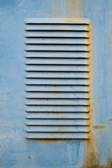 Old blue metal ventilation grille
