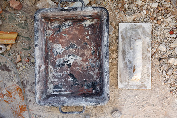 Mason tools on debris background