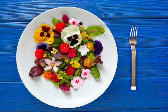Edible flowers salad in a plate