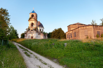 Fototapeta na wymiar Old abandoned orthodox church in the sunset light in Novgorod region, Russia