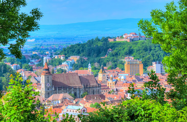 Fototapeta na wymiar Cityscape Brasov - Beautiful panoramic view over romantic architecture of Brasov town, Romania