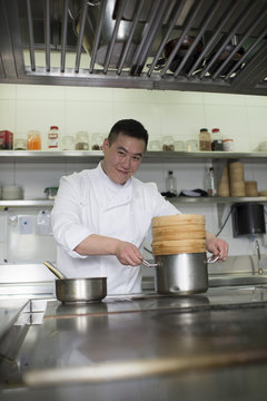 Portrait of the Chinese cook in the kitchen