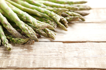 Green asparagus on grey wooden table
