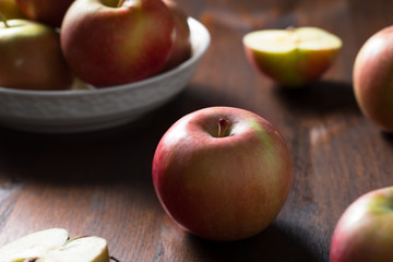 Homegrown ripe apples on rustic table horizontal