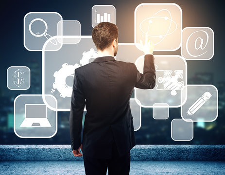 Businessman pointing at cells