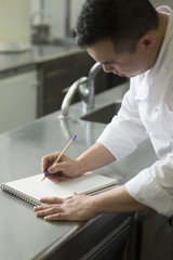 Chinese cook with notebook