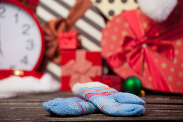 Obraz na płótnie Canvas photo of cute warm gloves near the the wonderful christmas decoration background