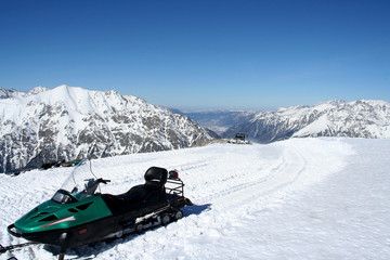 Snowmobile in the mountains of Dombai