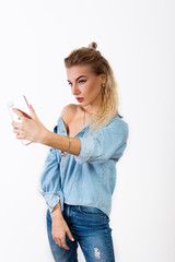 Beautiful blonde girl making selfie