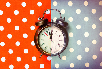 photo of cool alarm clock on the wonderful colorful background in pop art style