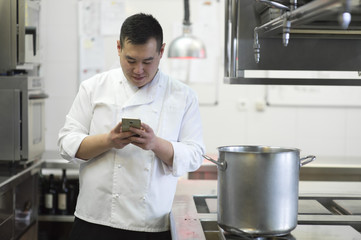 Chinese cook with smartphone